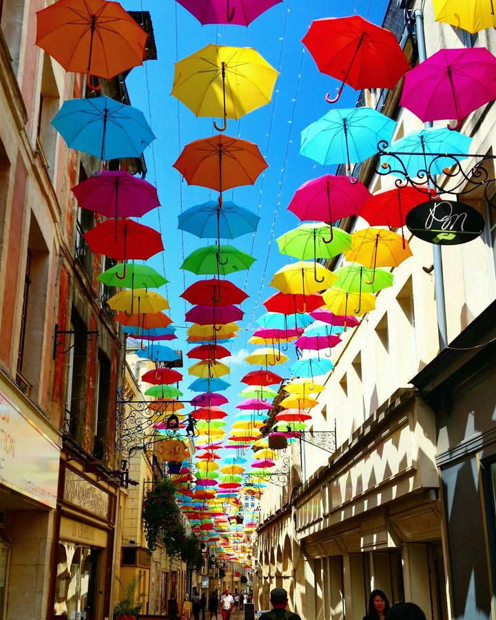 colorful umbrellas on the street of Laon, France