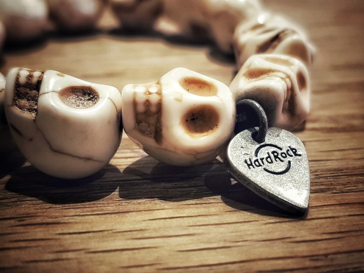 Skull bracelet with guitar pick