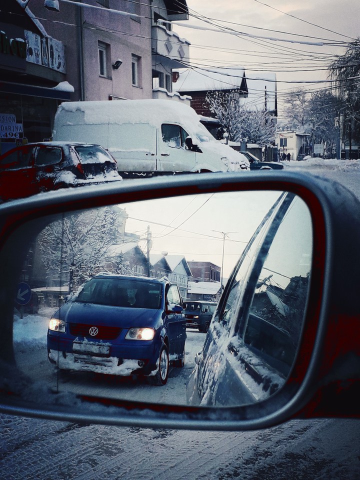 car in winter through mirror