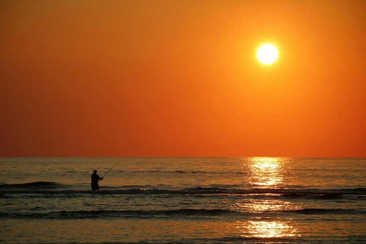 fisherman at sunrise