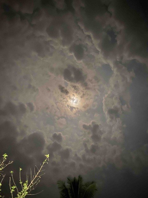 Moon behind clouds