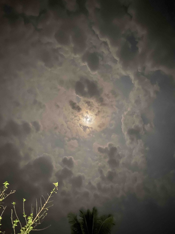 Moon behind clouds
