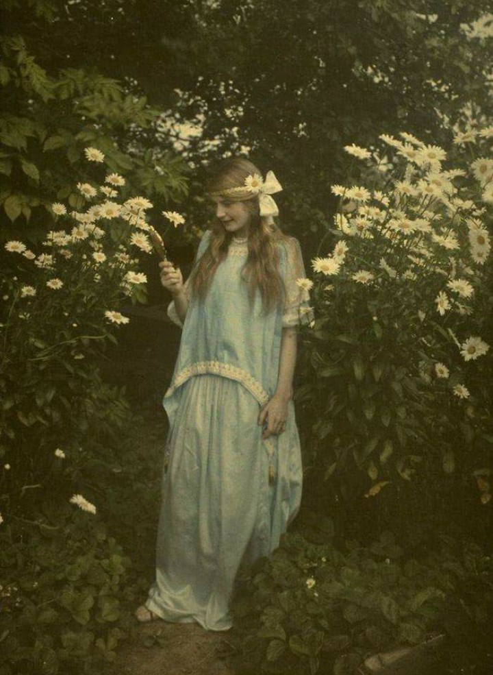 Girl amidst flowers, 1900s