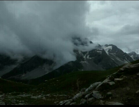 clouds under mountain