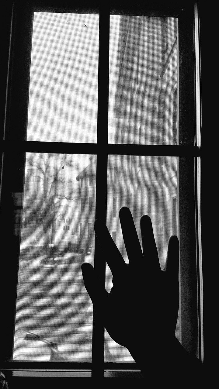 Hand on window