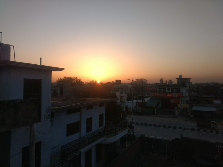 Rising city sun