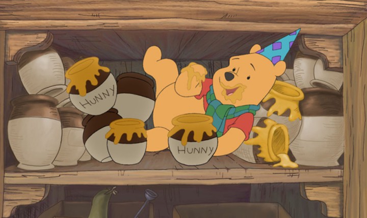 Pooh celebrating with honey