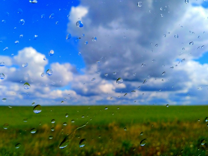 raindrops behind a glass of a car