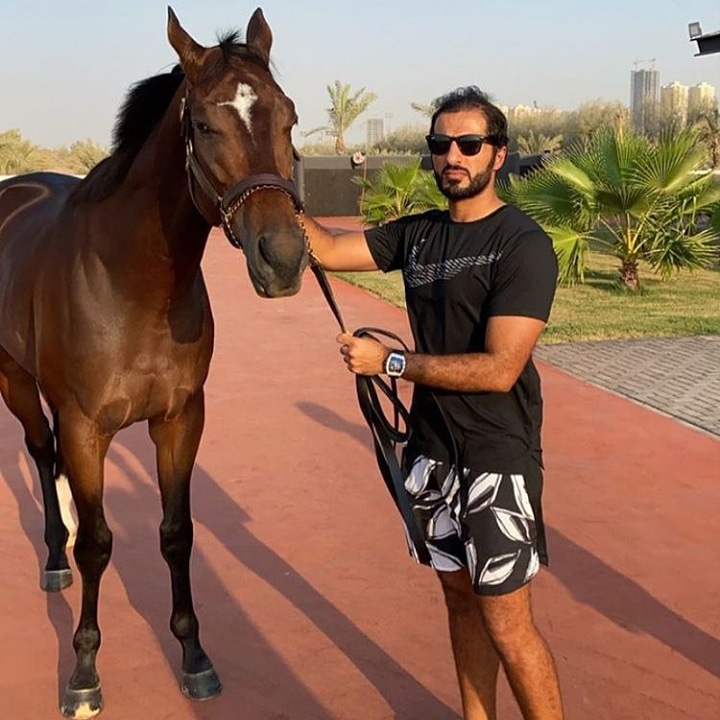 with my horse in the royal palace garden ajman
