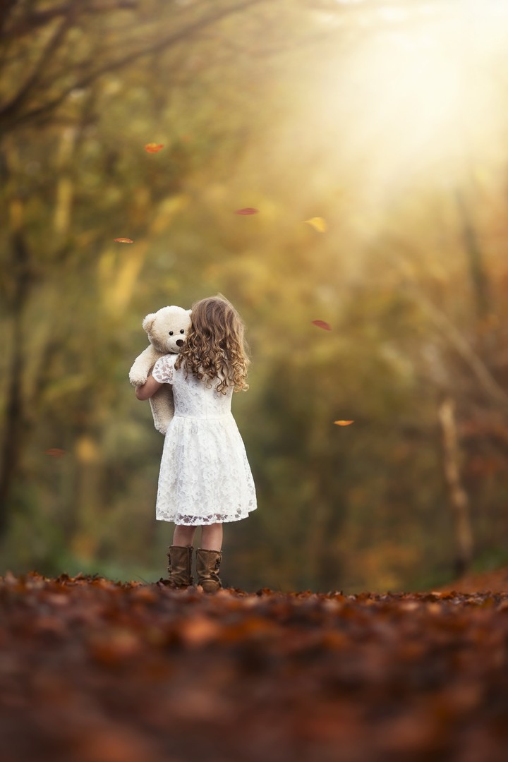 girl holding a teddy 