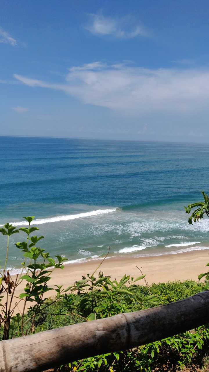Waves, lined up to crash against the shore.. ?