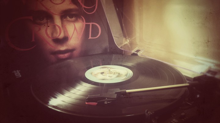 Vintage photo with a playing turntable,  Tom Odell vinyl