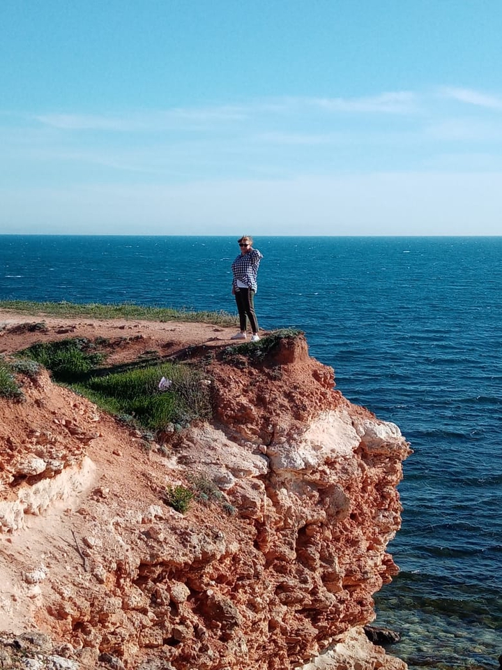 Above the cliff.