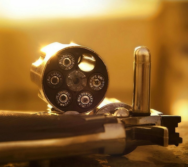 A Gun...