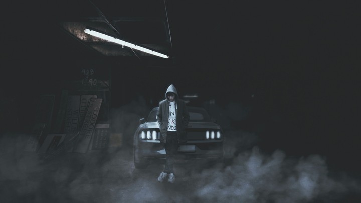 hood guy standing in front of a car