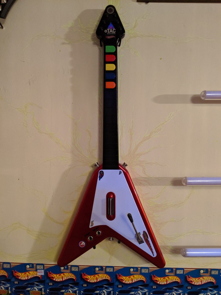 Guitar Hero controller on my wall in the man cave .