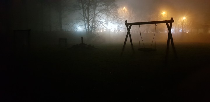 Foggy play area at night