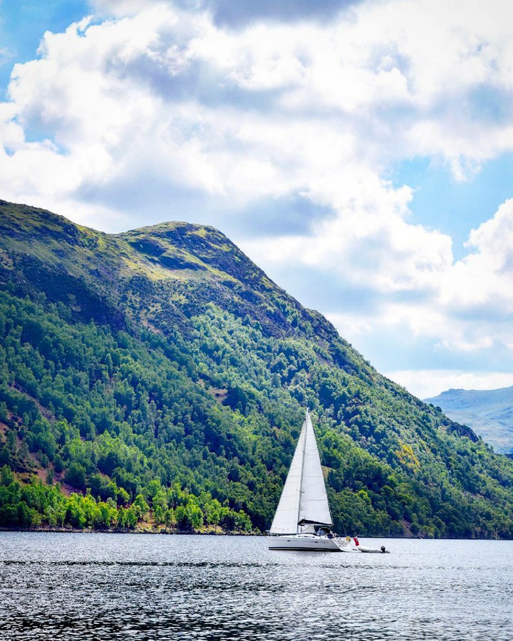Boat Front Of A Hill On Water