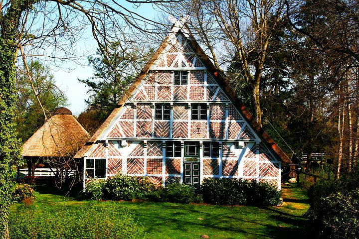 steep thatched-roofed home
