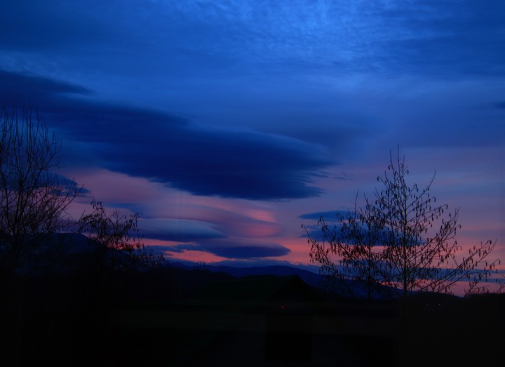 lenticular clouds above caucasian mountains