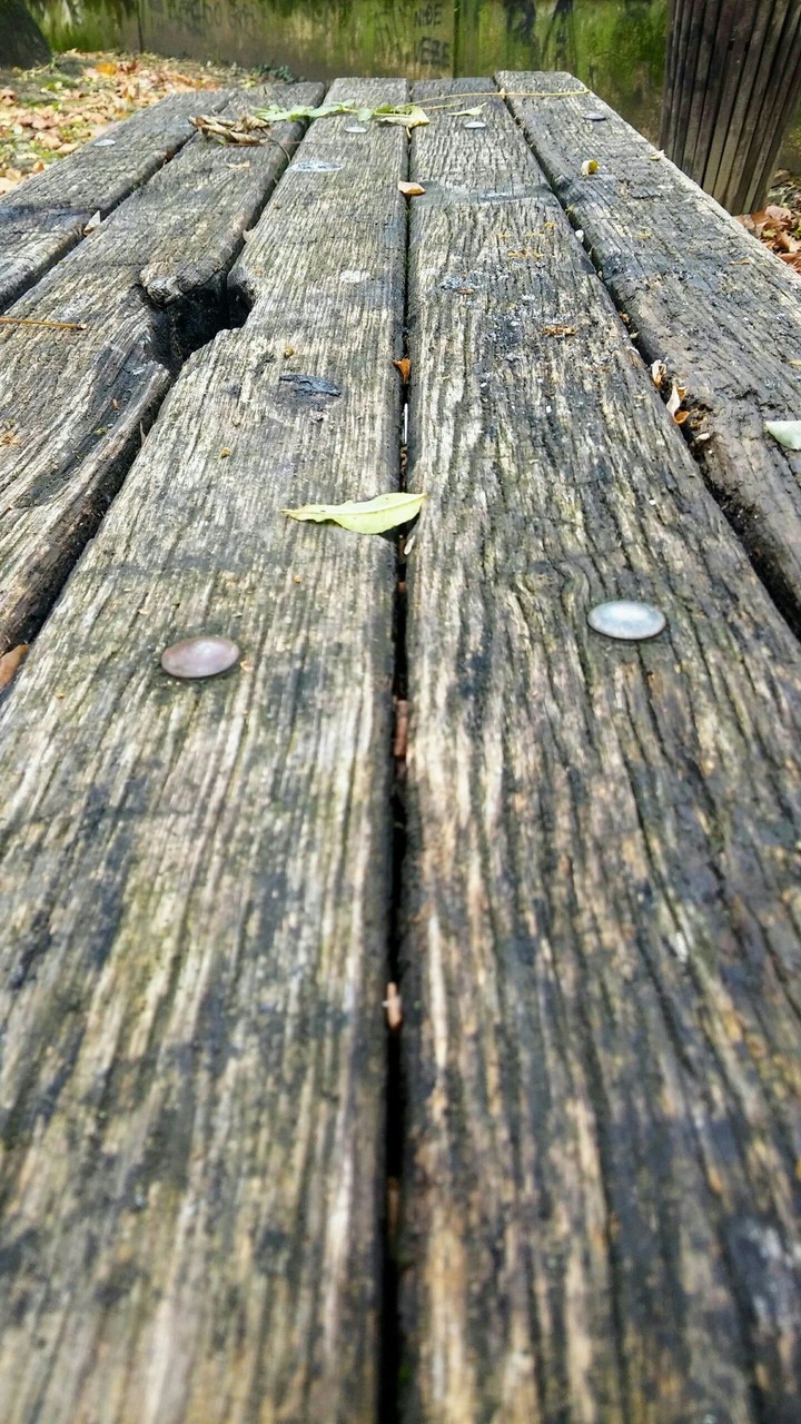 Wooden old table in the Park.