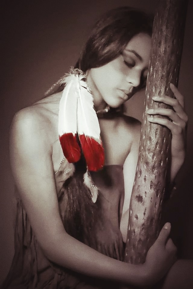 Indian squaw with a rainstick.