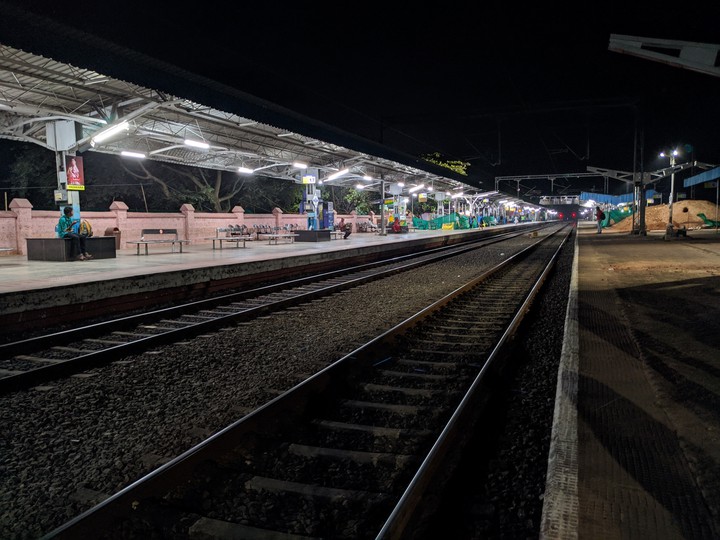 An almost empty Railway station at Night