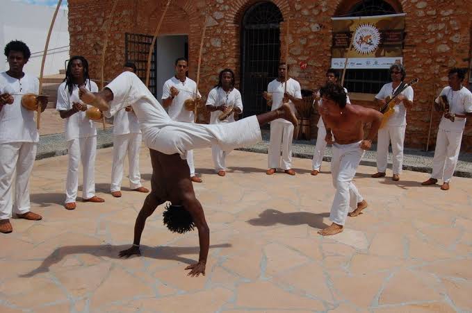 Capoeira mixes martial art, sport and music. Afro-brazilian