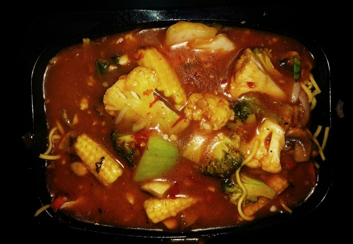 Noodles topped up with red gravy