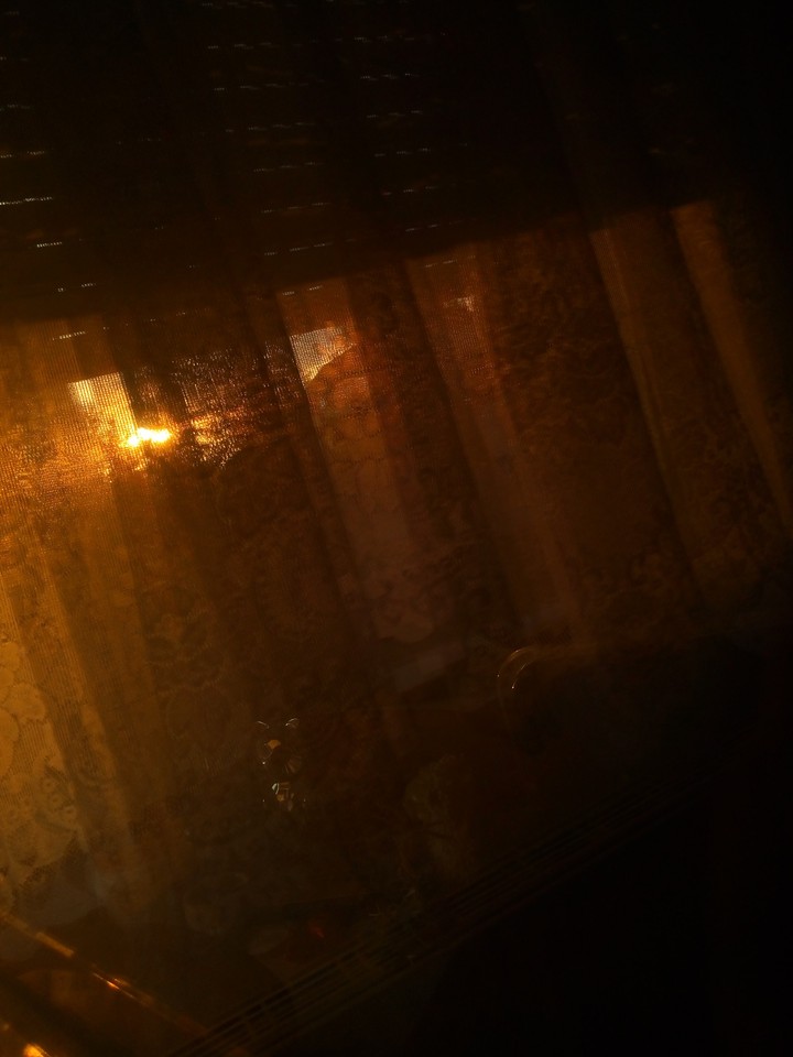 sunrise in window reflection