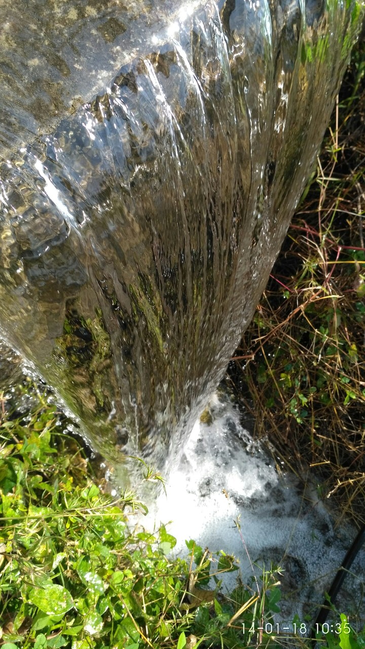a small water fall in the farm.
