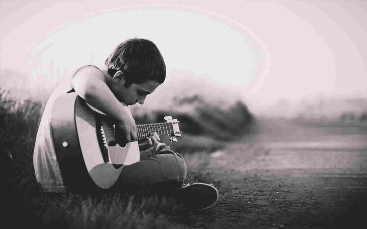 kid playing guitar