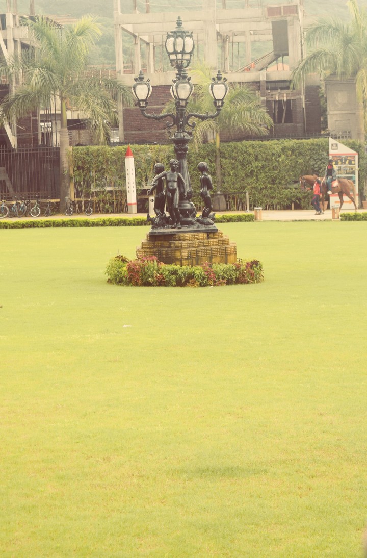 statue black green ground