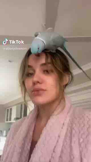 Lady with parrot ? on head