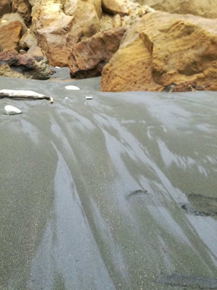 Glistening black sand
