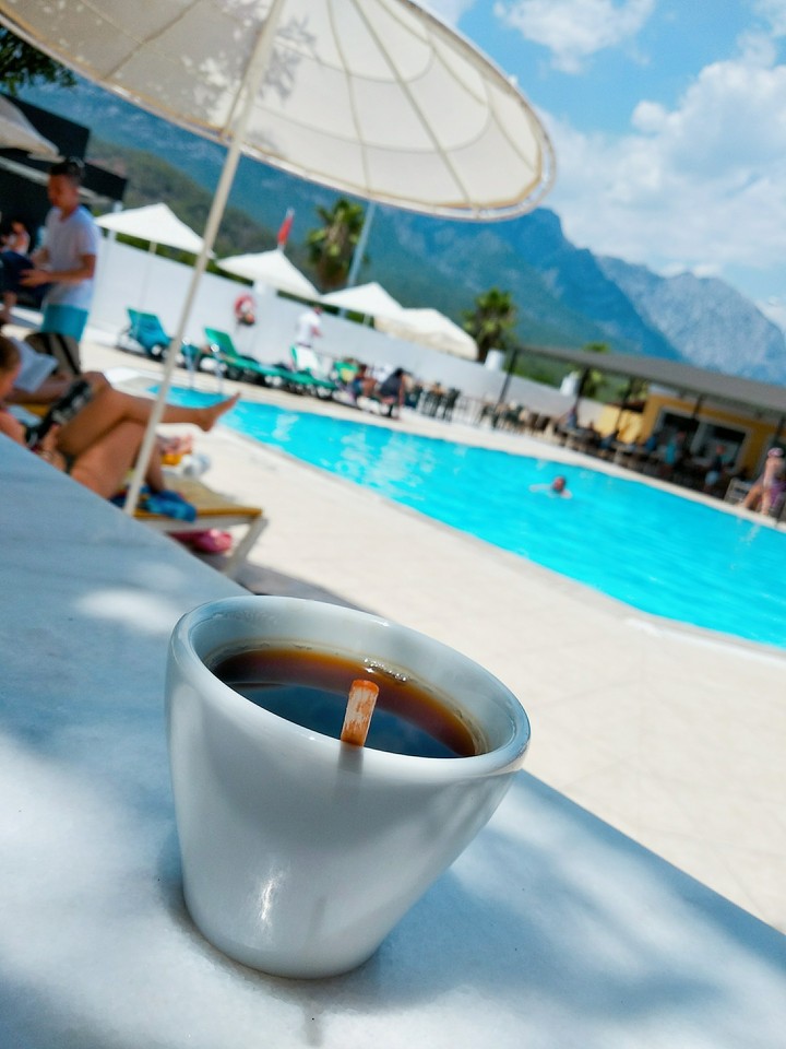 a cup of tea by the pool