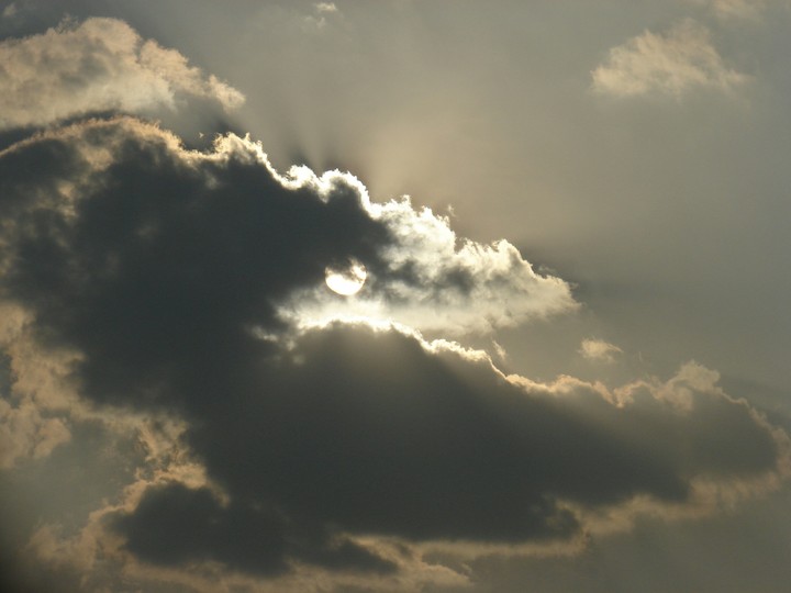 Sun rays glittering out of the cloud's outline