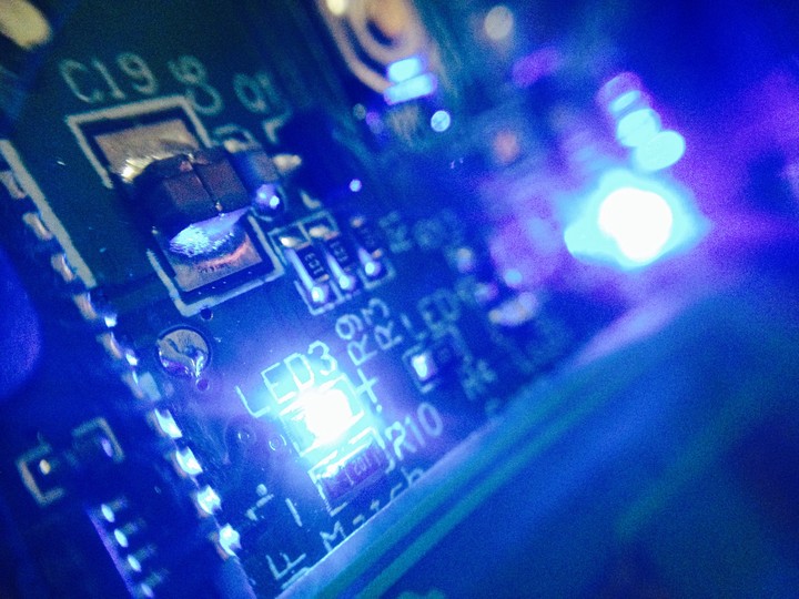 close up look of an circuit board with LED lights