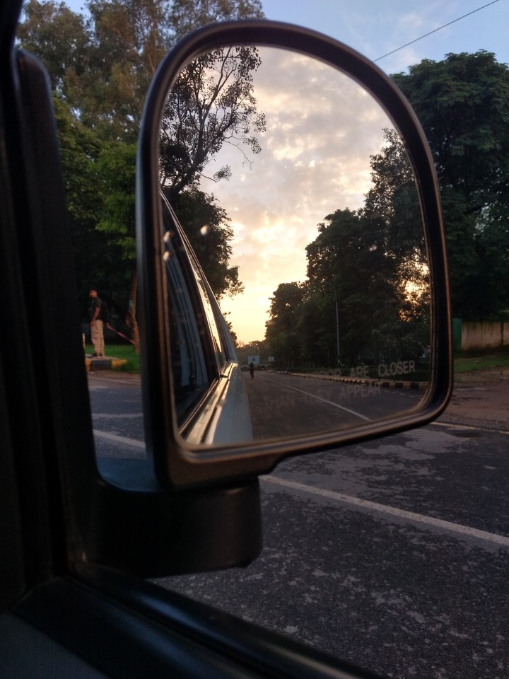 Sun sets in my mirror.