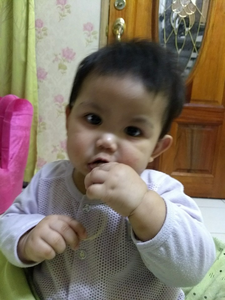 baby eating snack