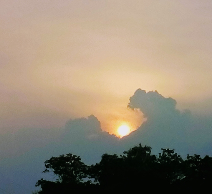 sun eaten by clouds
