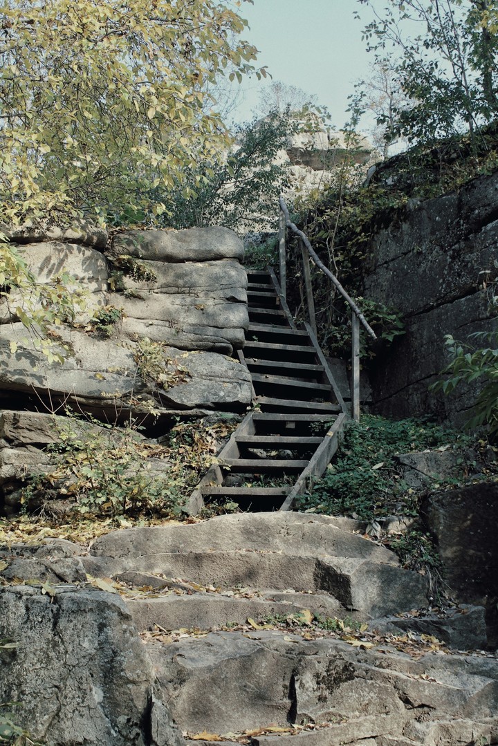 Old wooden stairs in rock