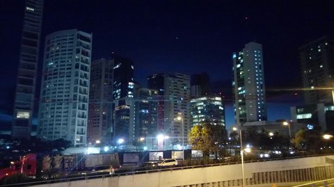 Night falls over the city.