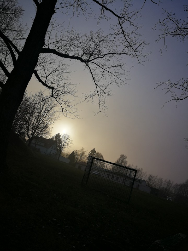 sun behind fog