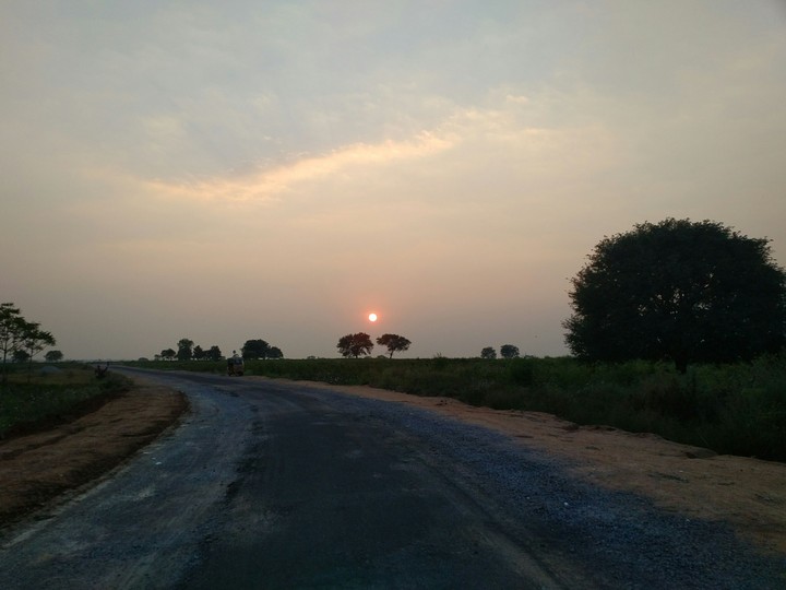 sunset from a village road