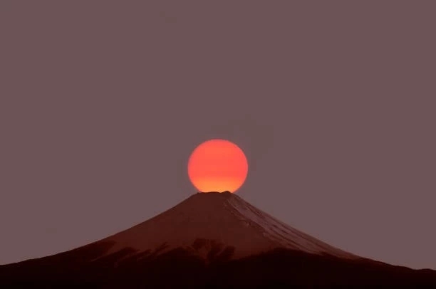 red sun at peak of Mt. Fuji