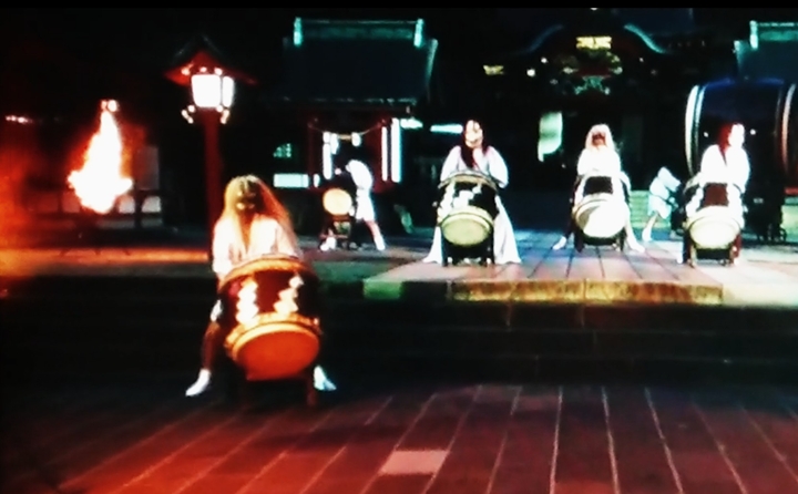 demon-masked drummers