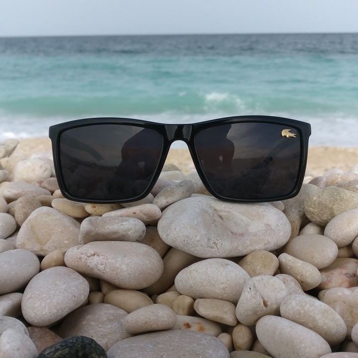 Lacoste on pebbles