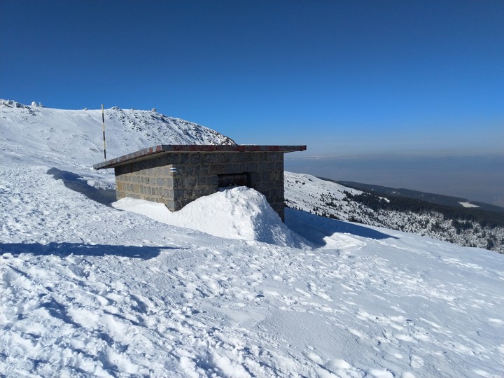 HEAVY-SNOWED SHELTER