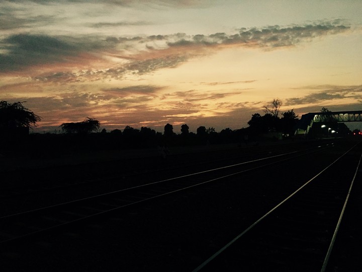A pleasant evening at a Indian railway station .